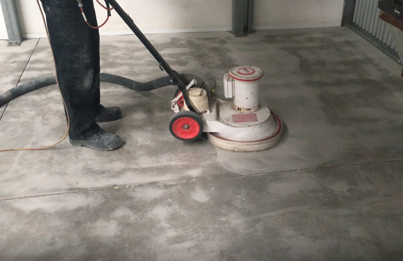 A Polivac machine with a Diamabrush tool attached being used to prepare concrete.